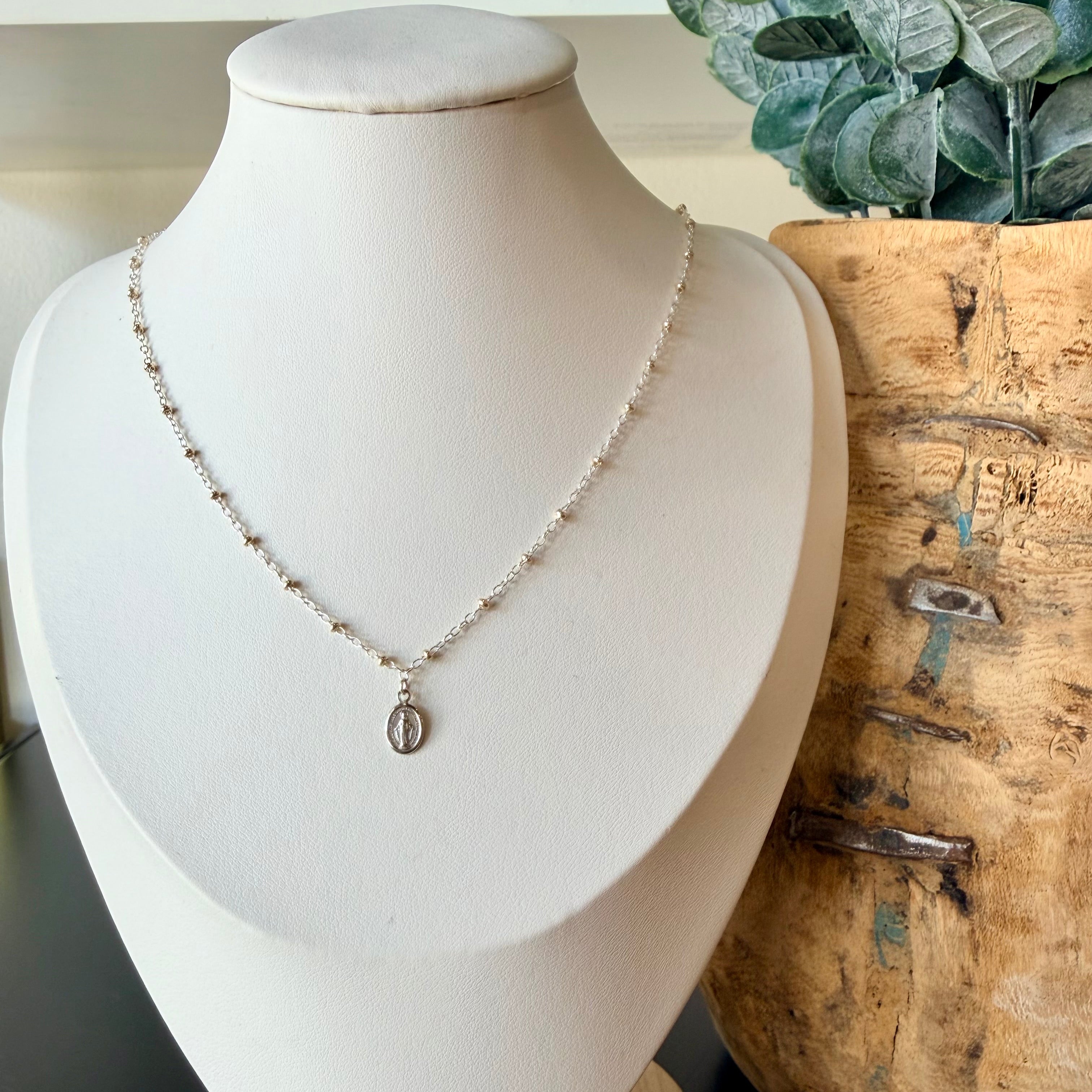 Miraculous Medals, known as a symbol of protection, guidance, and grace. Charm placed on a mixed metal delicate cable chain - Silver with gold beads.