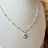 Miraculous Medals, known as a symbol of protection, guidance, and grace. Charm placed on a mixed metal delicate cable chain - Silver with silver beads.