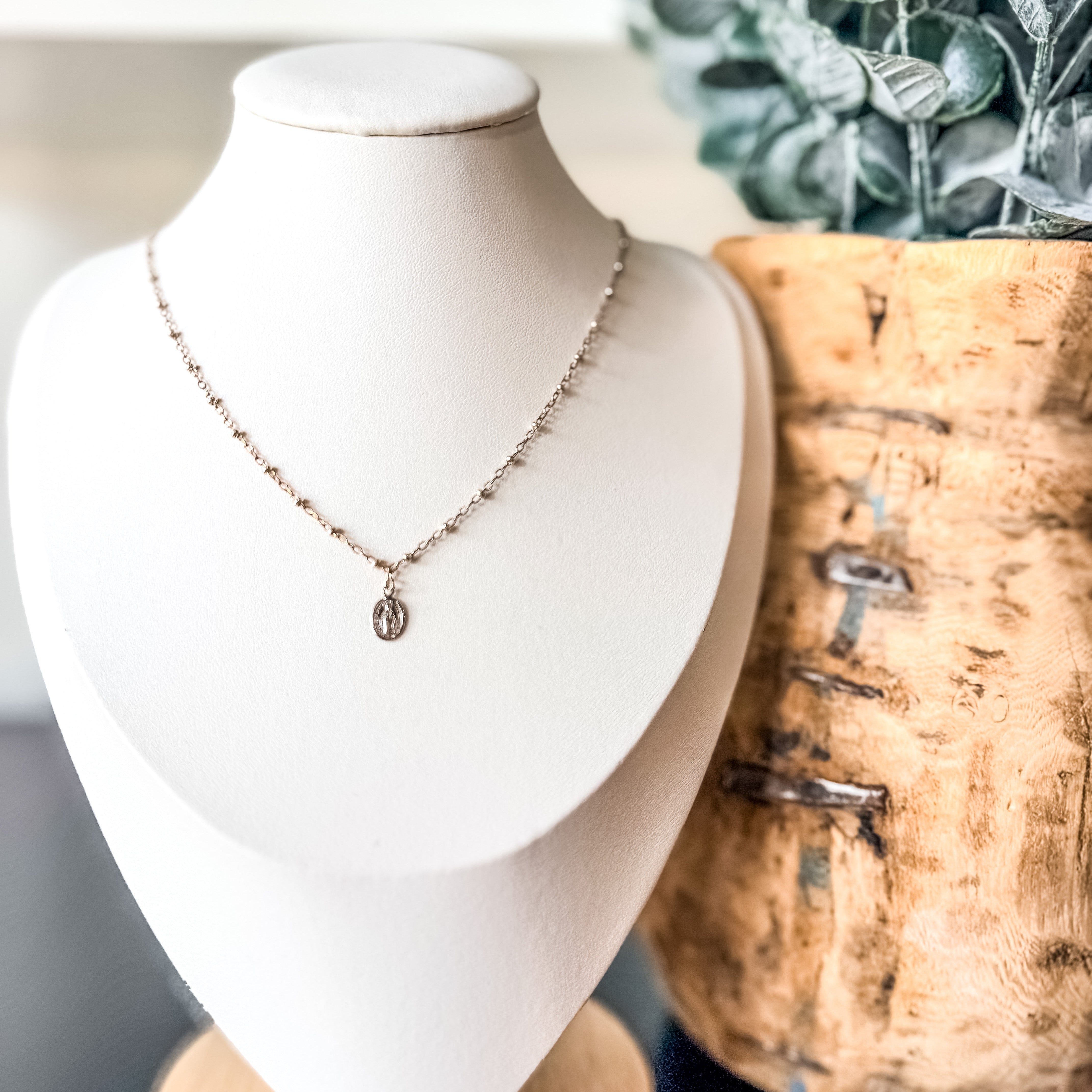 Miraculous Medals, known as a symbol of protection, guidance, and grace. Charm placed on a mixed metal delicate link chain. 